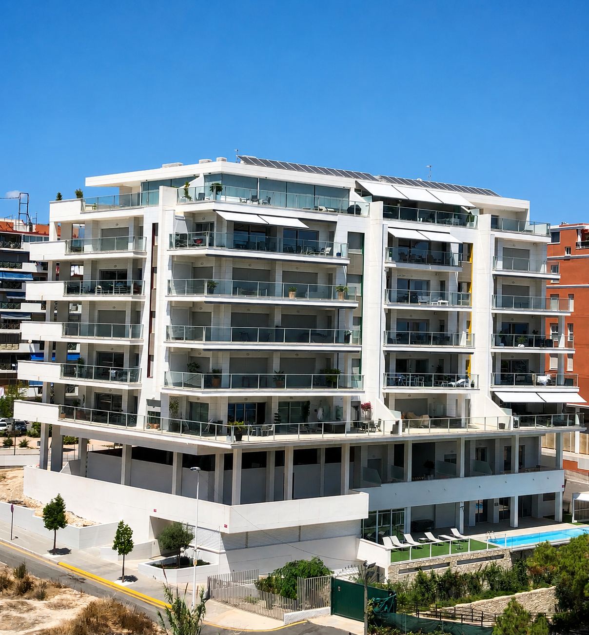 Panorama Suites — the white residential building facing the sea